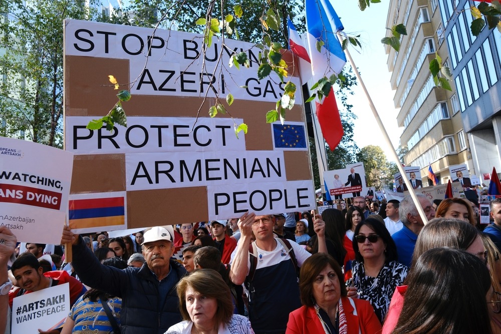 Protestors,Carry,Placards,And,Wave,Armenian,Flags,During,A,Demonstration