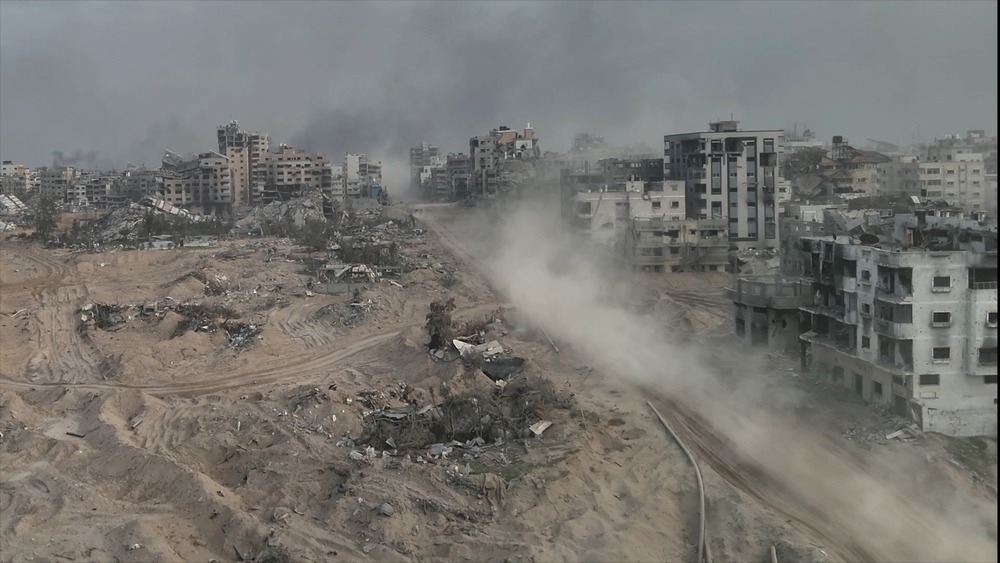 Tank,Driving,With,Dust,In,Al Shati,Refugee,Camp,,Gaza,,Aerial